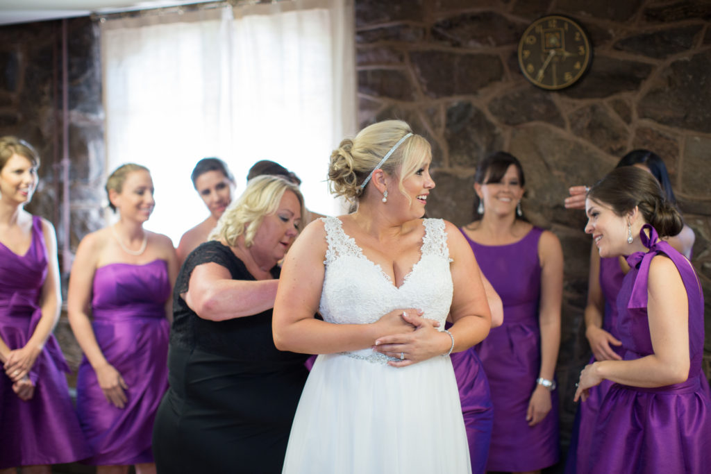 bride getting ready with bridesmaids at Boettcher Mansion wedding