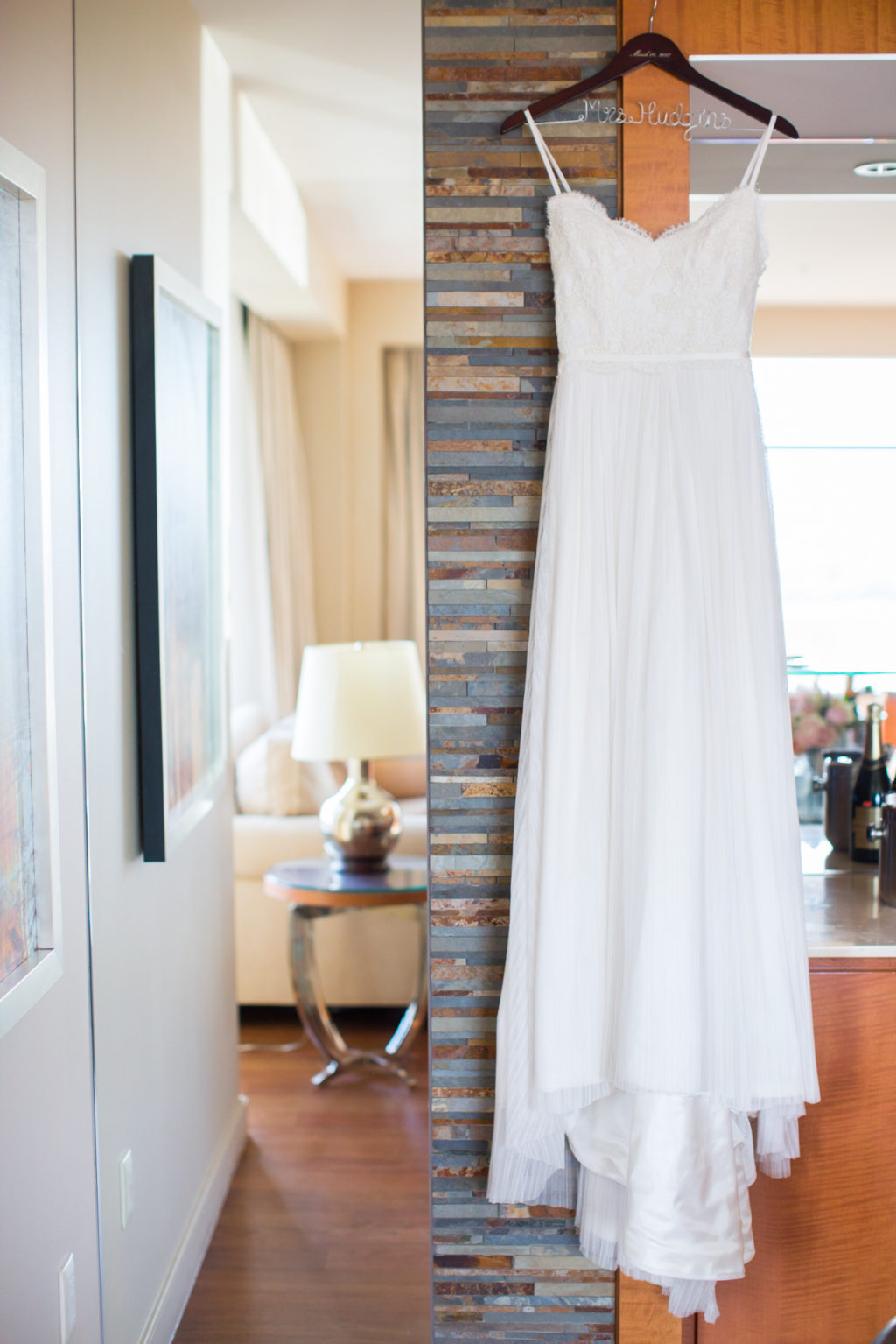white wedding dress hanging for getting ready photo. four seasons hotel denver wedding