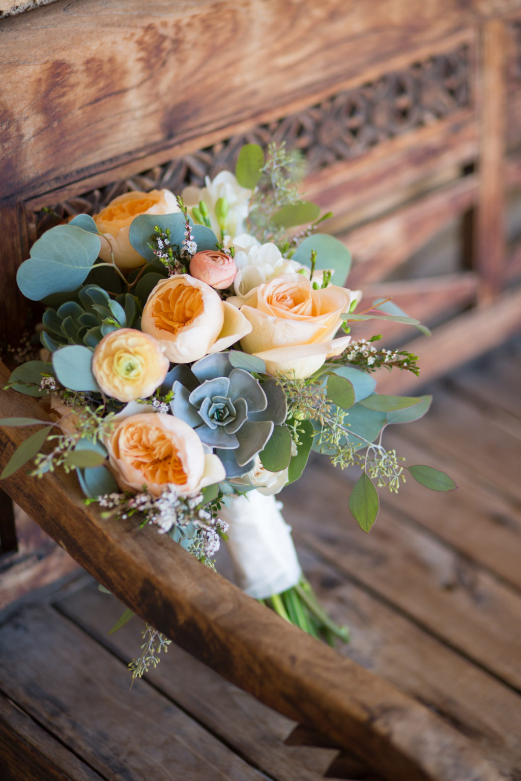 villa parker wedding bridal bouquet succulents, coral, green eucalyptus leaves