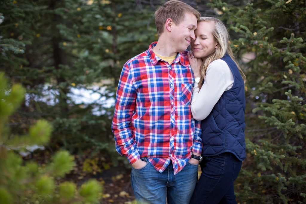 evergreen colorado engagement session sweet couples snuggles up