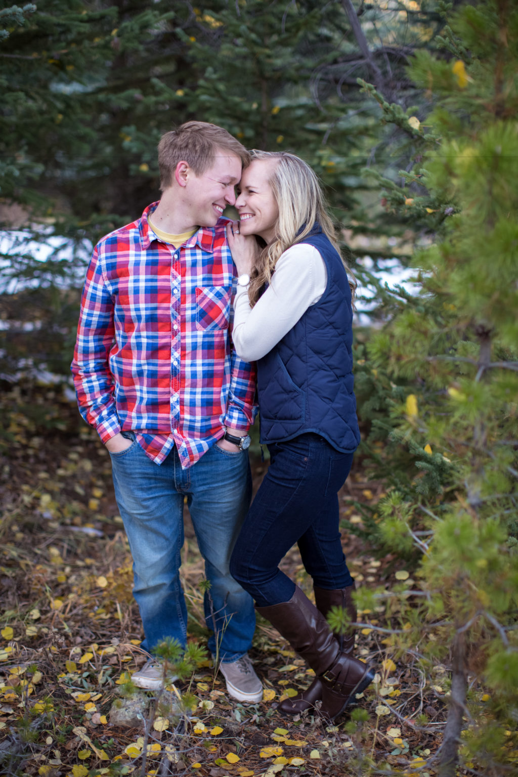 evergreen colorado engagement session sweet couples snuggles up and gets cuddly in plaid and vest