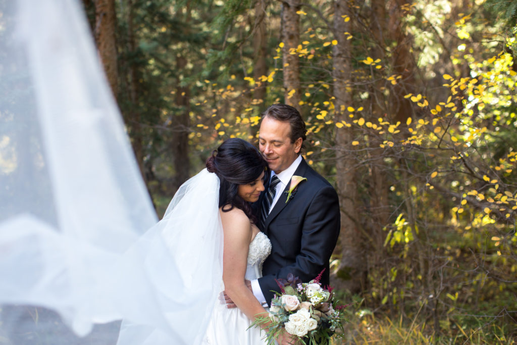 super fun veil photo bride and groom portraits taken after T Lazy 7 ranch wedding in aspen colorado