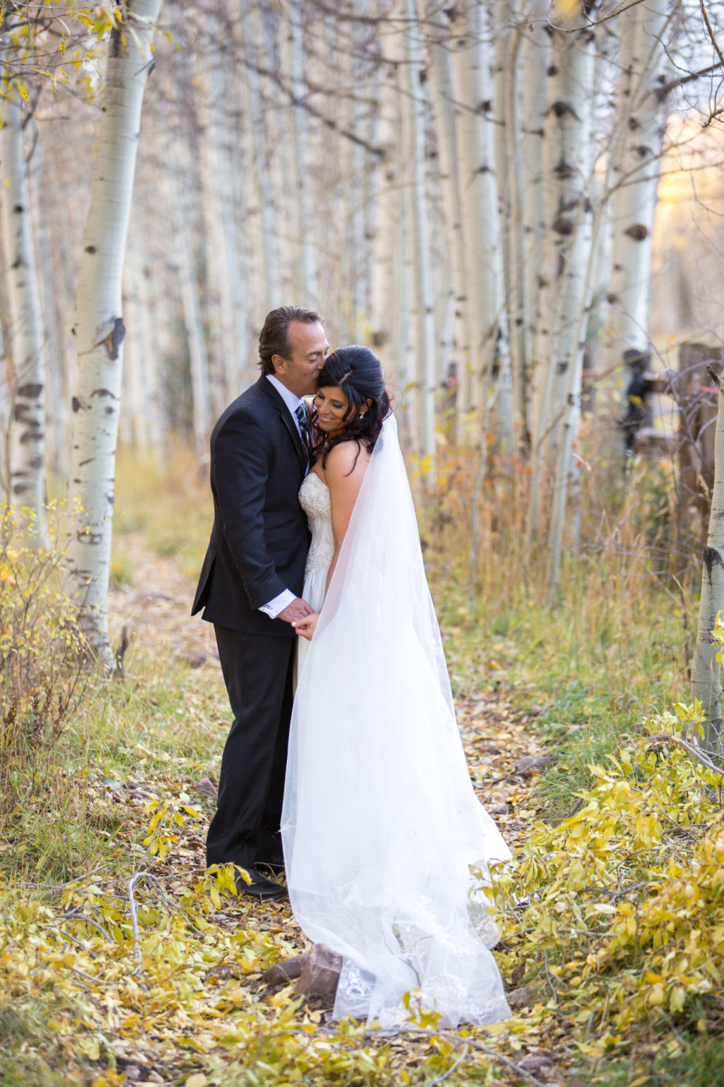 bride and groom photos taken after T Lazy 7 ranch wedding in aspen colorado