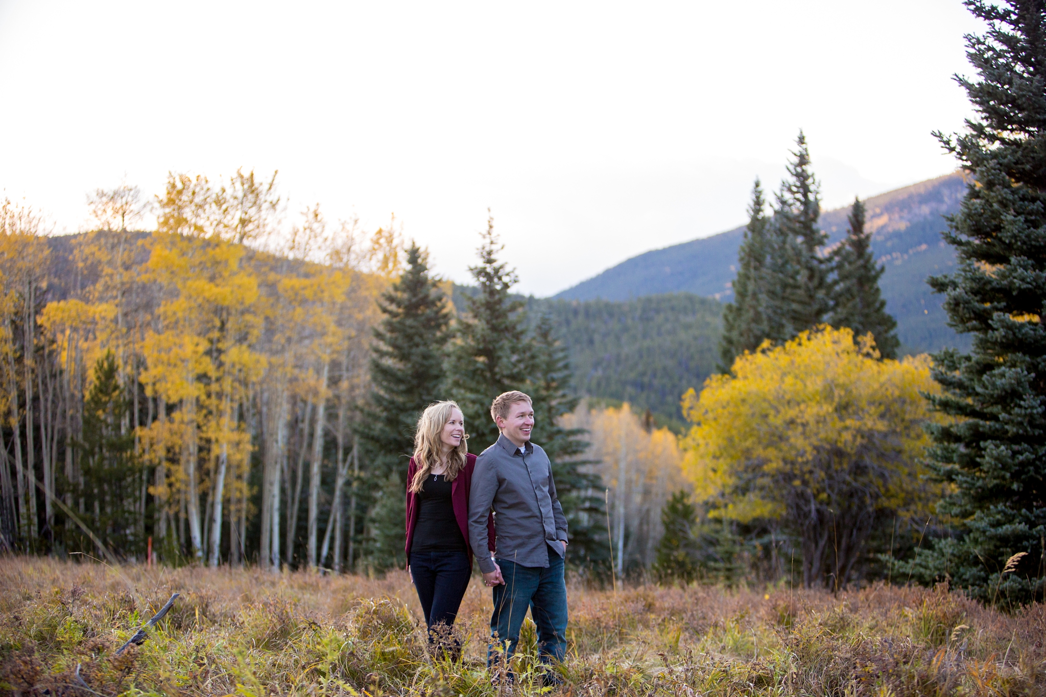 what to wear for an engagement session in the fall yellow aspens maroon and grey