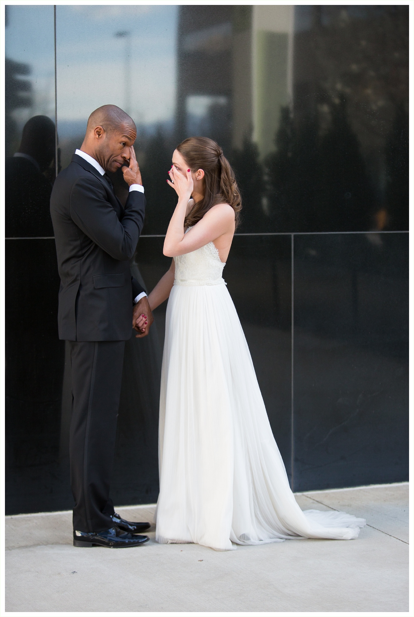 sweet bride and groom are both crying during first look on wedding day