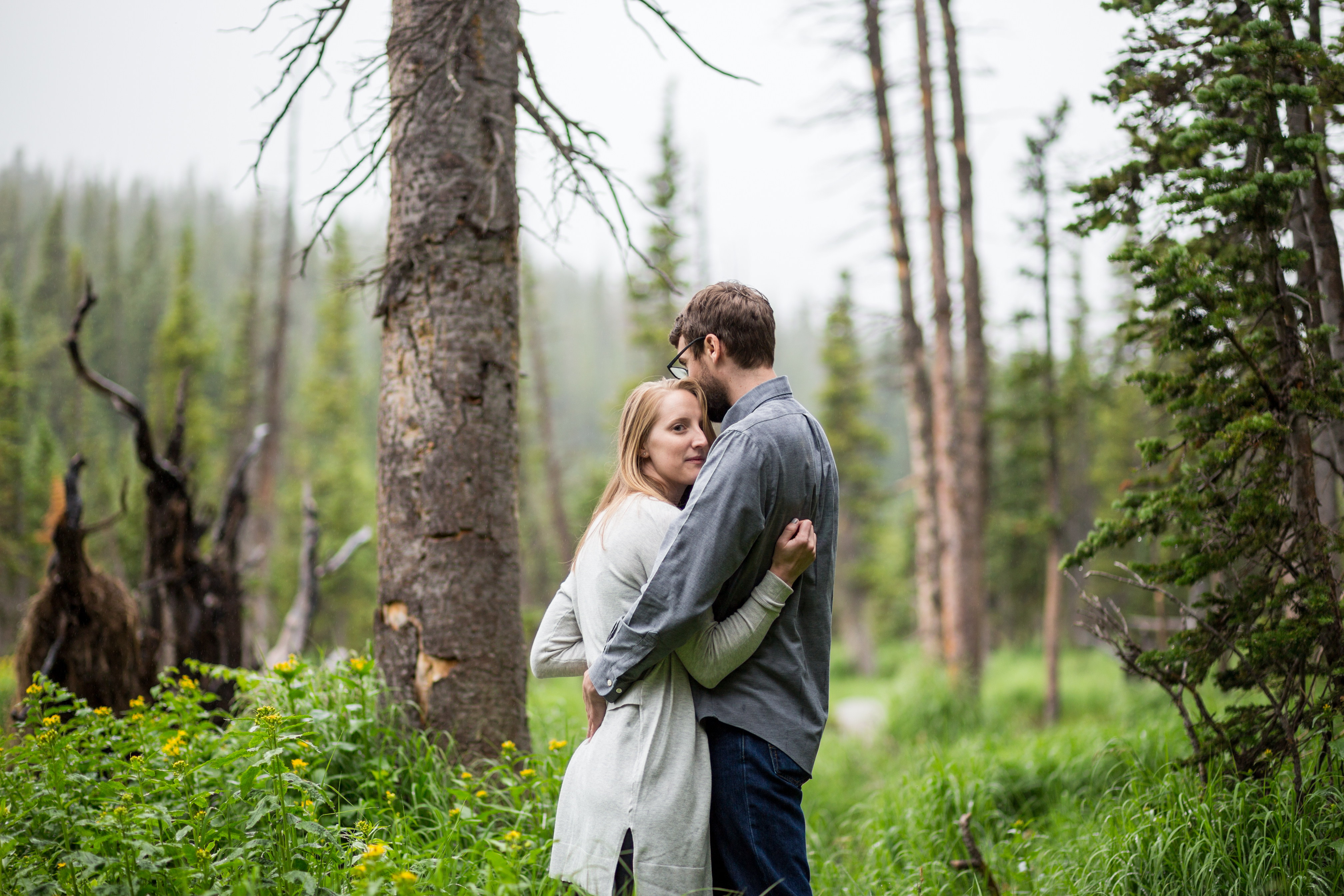 Brainard Lake engagement photos at Long Lake bride and groom snuggle serious and stoic