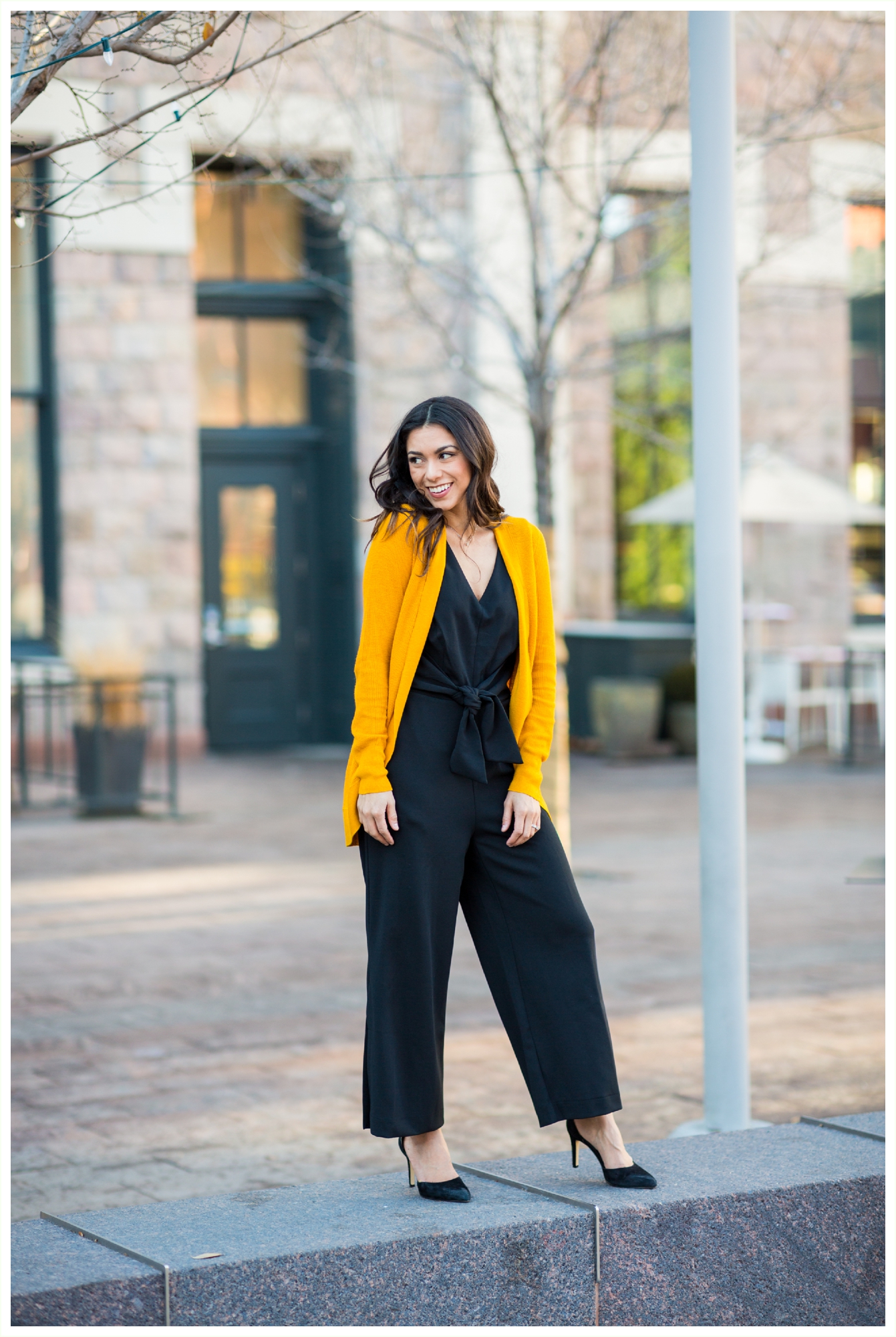 Lifestyle personal branding photo session for a sales entrepreneur. Client wearing super cute vibrant yellow sweater and fashionable hat. Cute candid photos by Denver personal branding photographer Kathryn Kim Photography