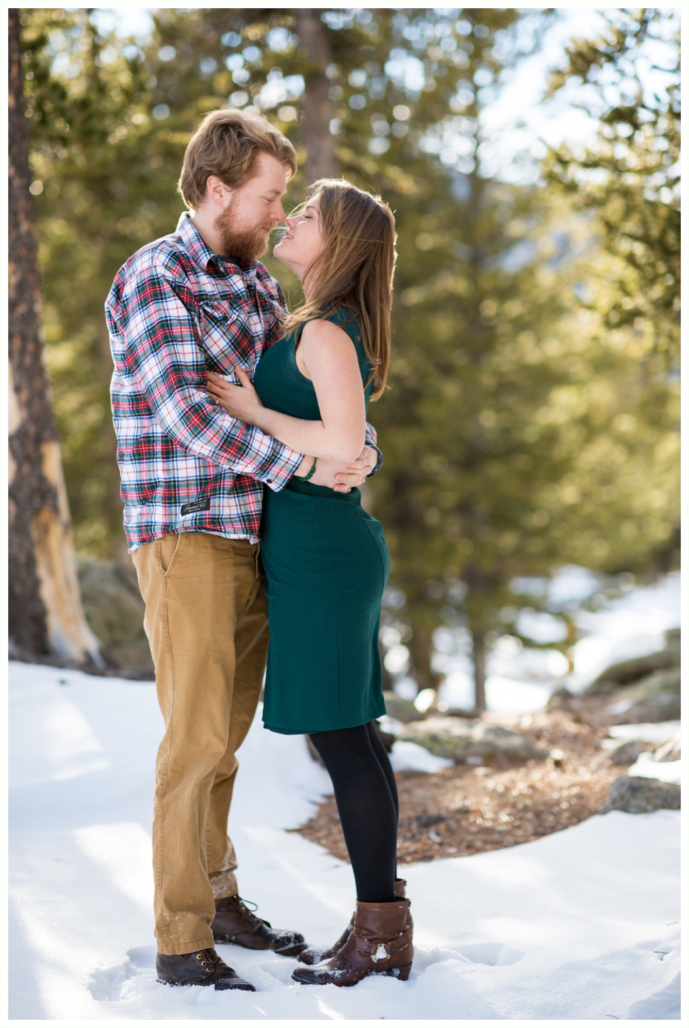 Echo Lake Park winter engagement session in the Colorado mountains. Colorado mountain wedding photographer. Colorado engagement photographer. natural candid Colorado engagement photography. Outdoor winter engagement photos in Colorado mountains. intimate almost kissing photo between couple. 