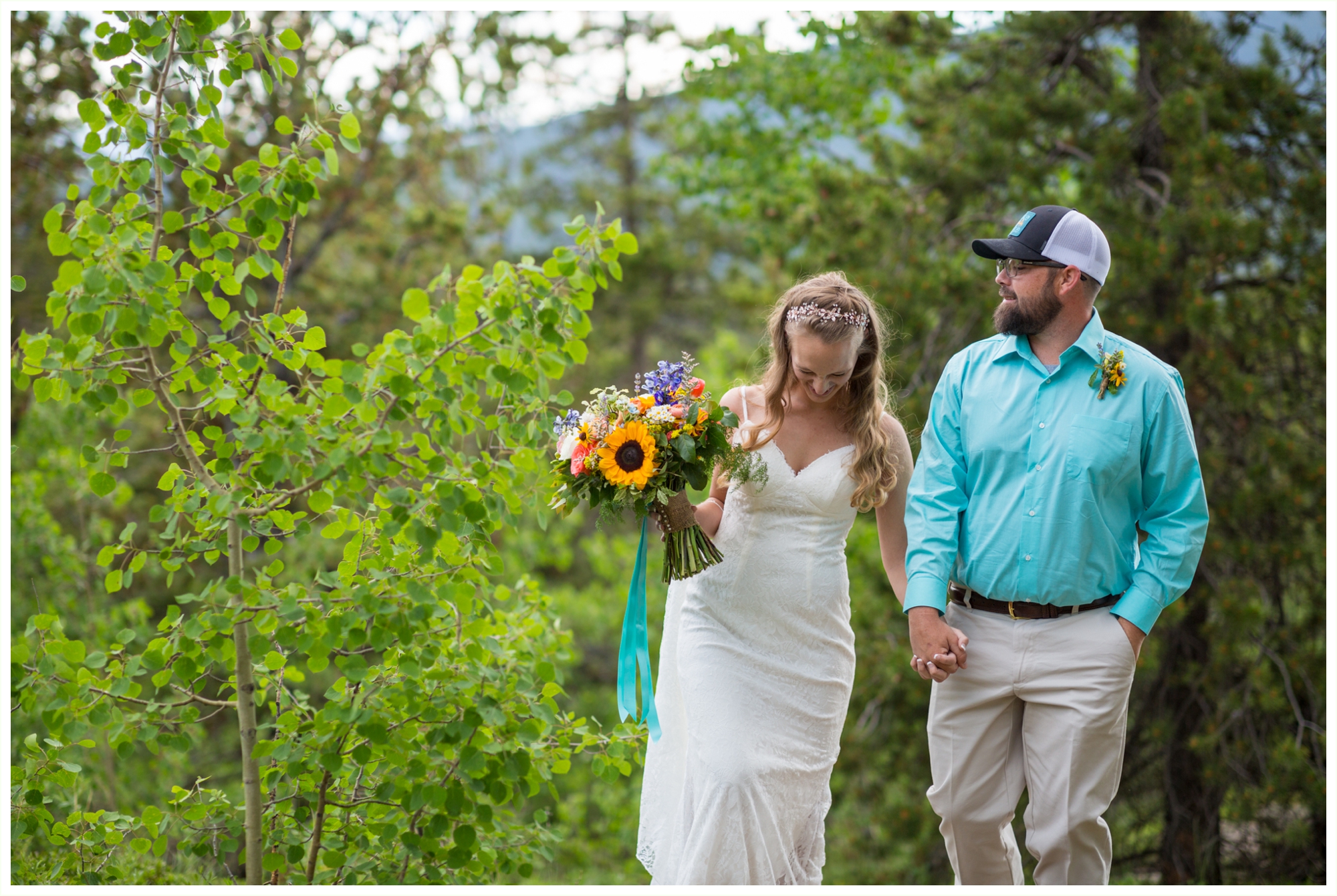 bride and groom take portraits before summer destination elopement at panorama point in colorado mountains 