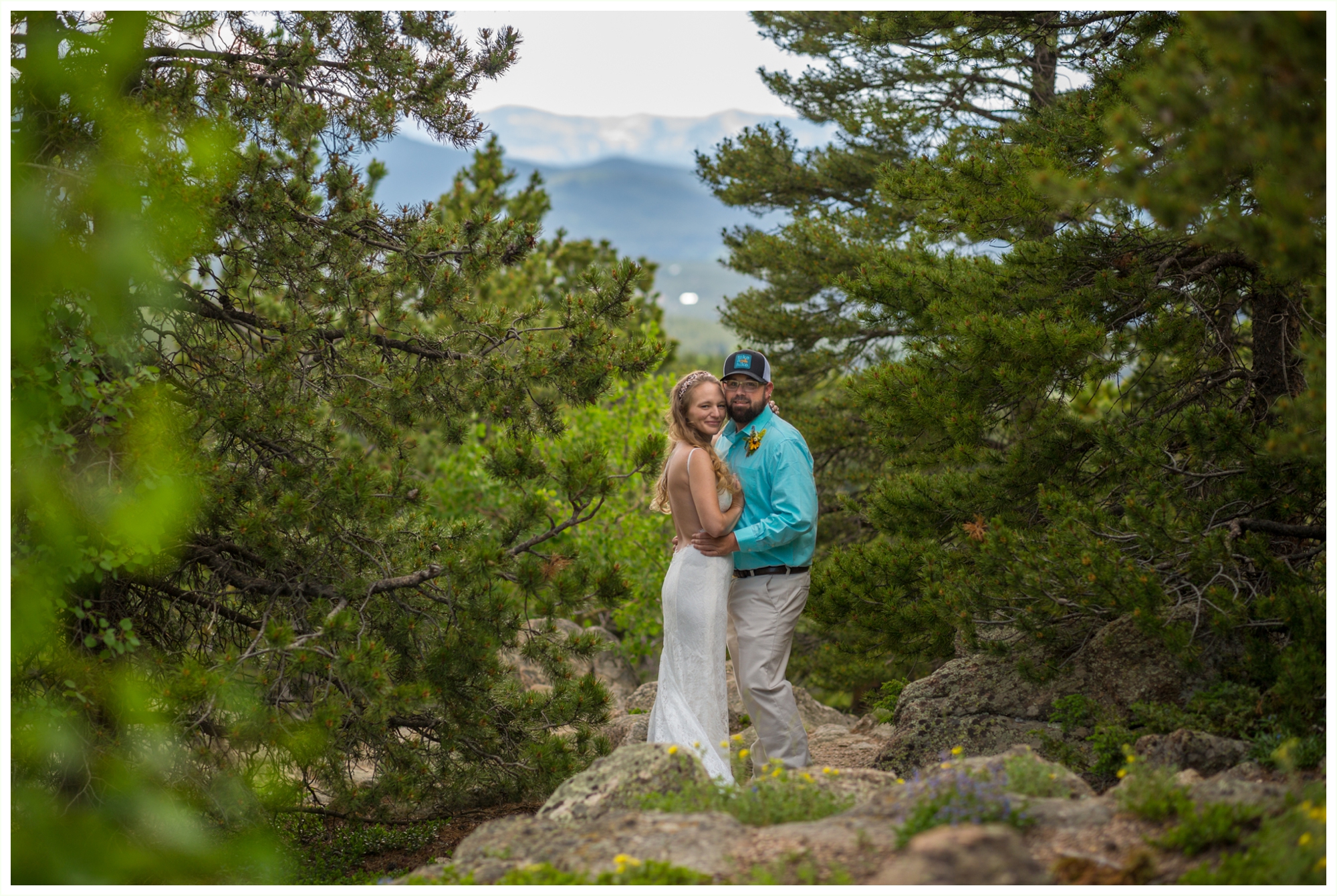 bride and groom take portraits before summer destination elopement at panorama point in golden gate canyon state park in colorado mountains 