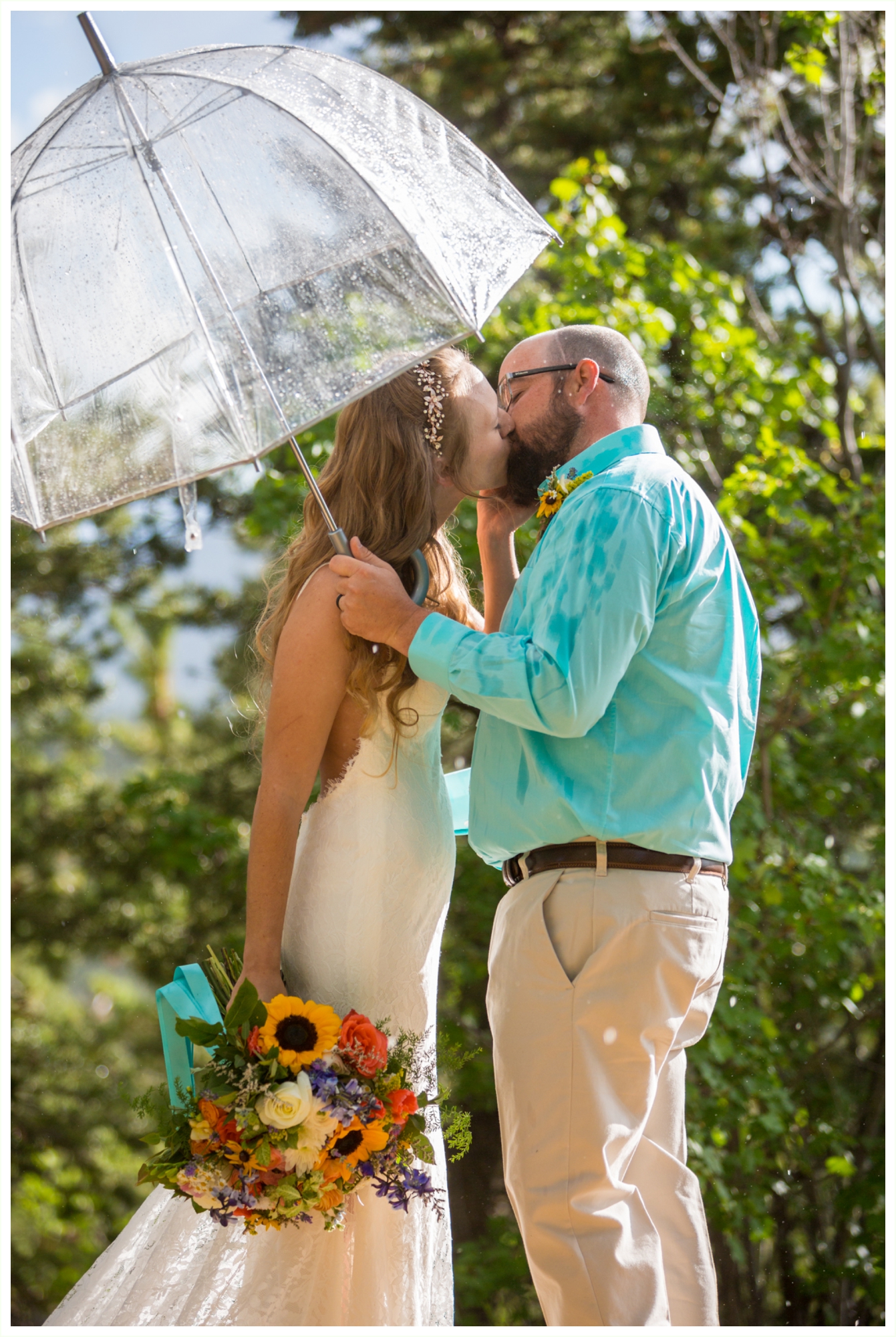 rainy first kiss during summer elopement in golden gate canyon state park elopement in colorado