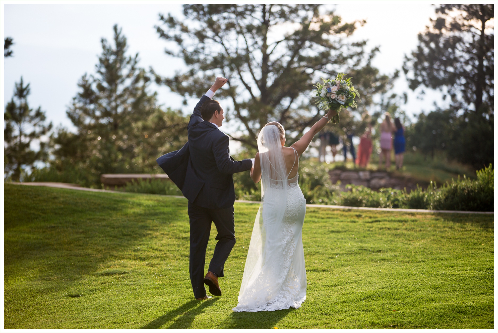 bride and groom candid outdoor portraits after sanctuary golf course wedding ceremony in colorado