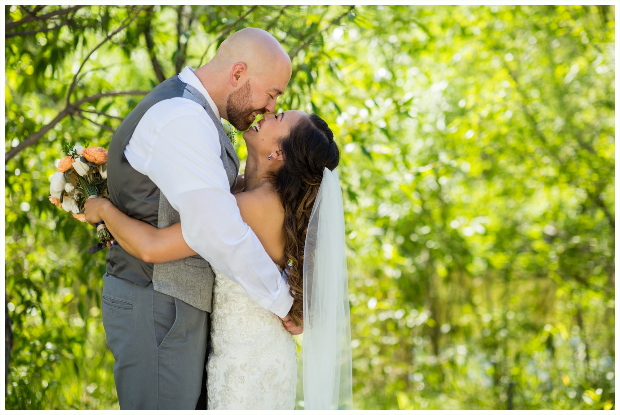 bride and groom take candid natural fun portraits at outdoor wedding in colorado