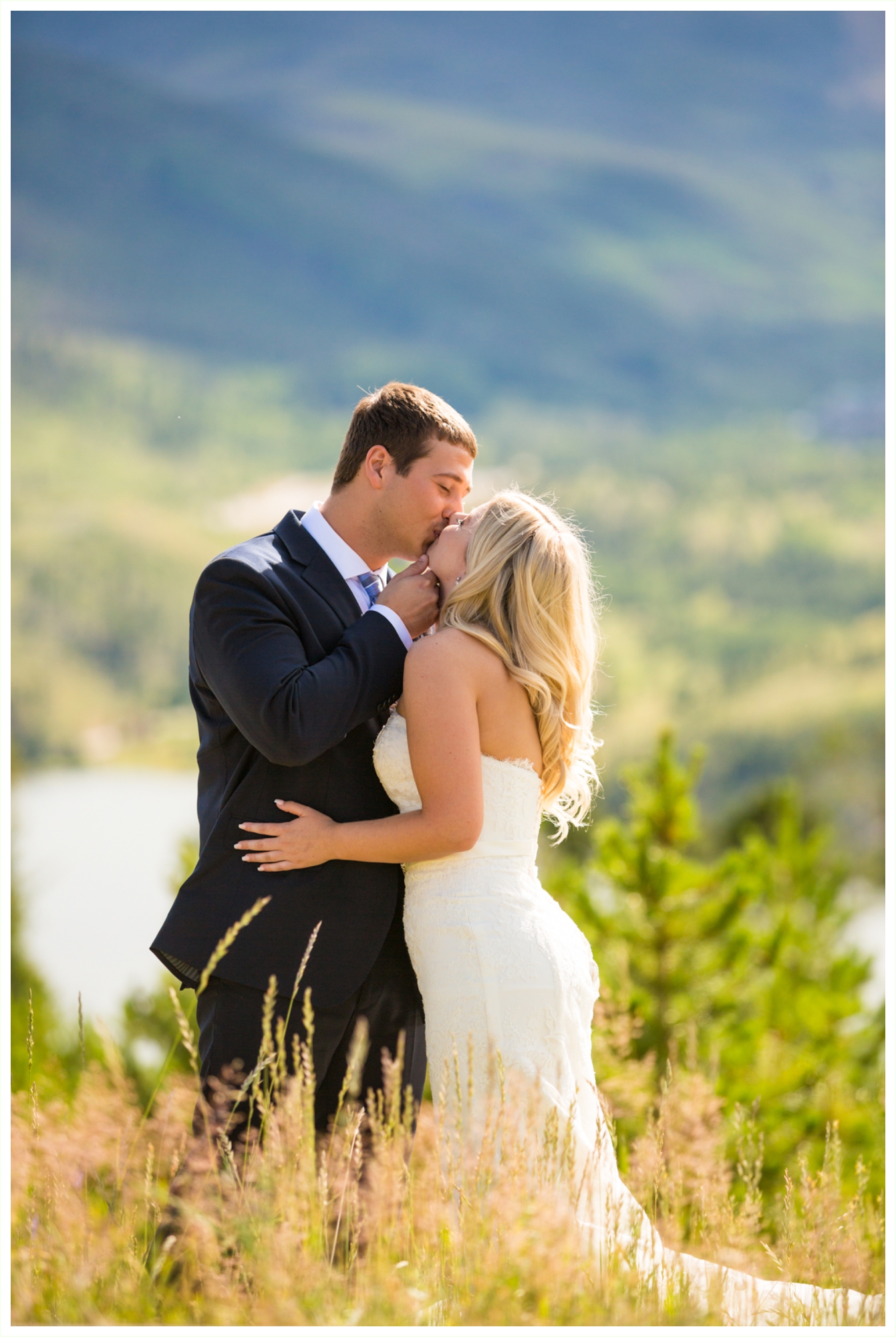 bride and groom candid natural kissing wedding portraits at sapphire point overlook lake dillon