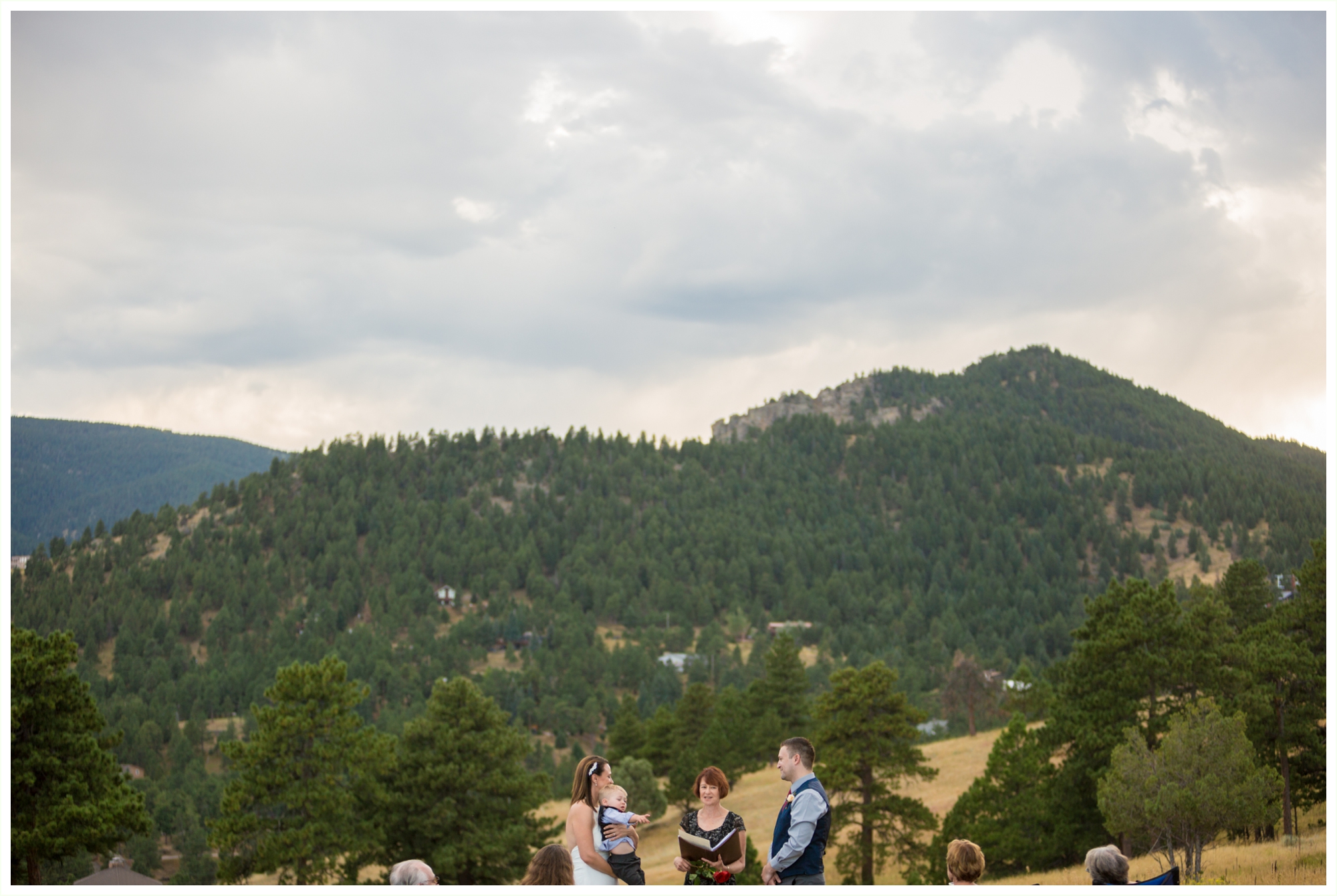 sweet candid moment during intimate elopement at betasso preserve boulder colorado wedding ceremony