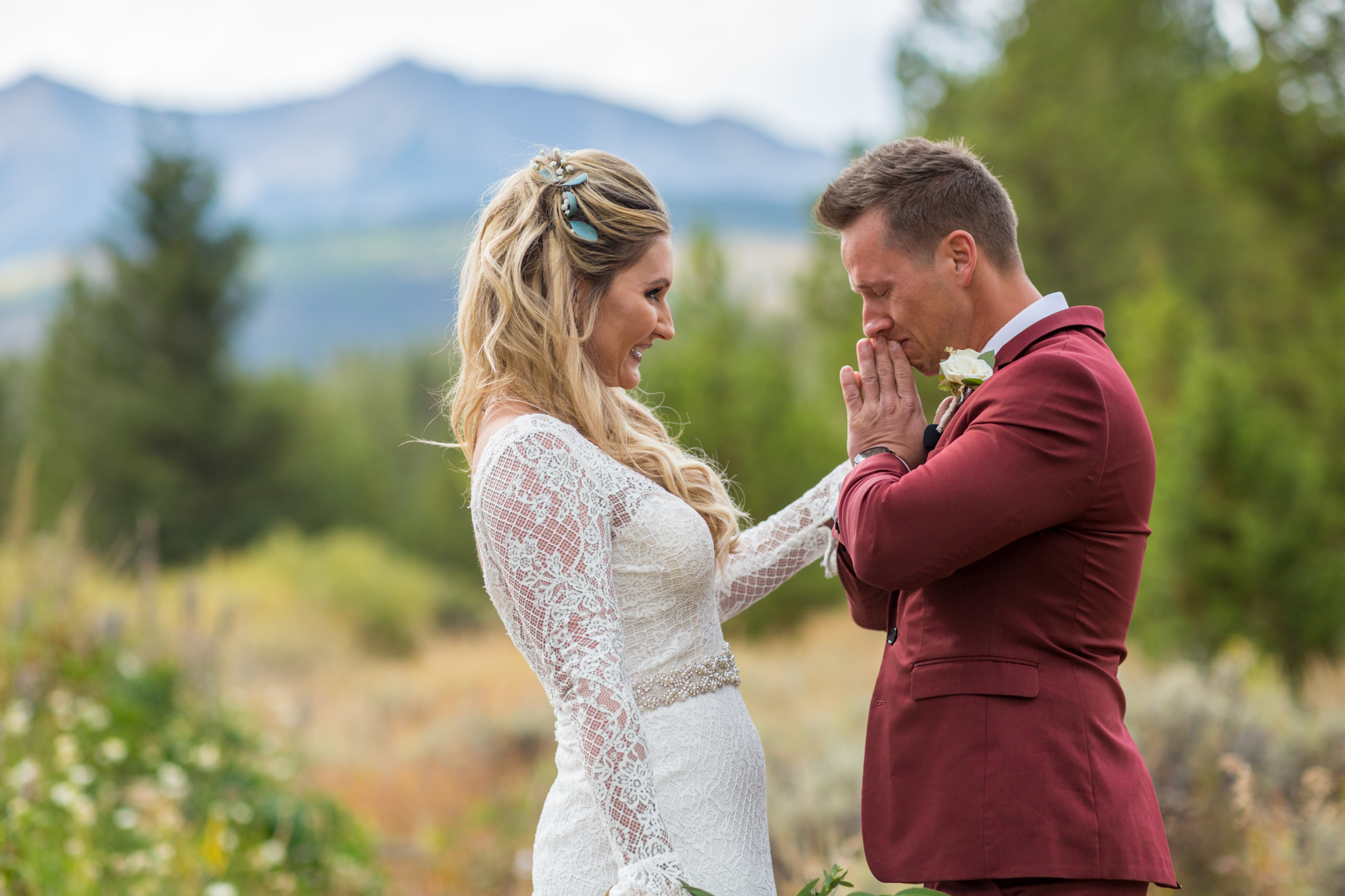 emotional crying groom during first look in breckenridge colorado captured by colorado mountain wedding photographer kathryn kim