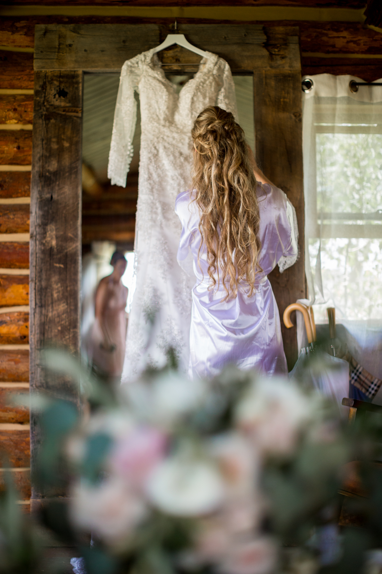 stunning romantic getting ready photo of bride at strawberry creek ranch by colorado mountain wedding photographer