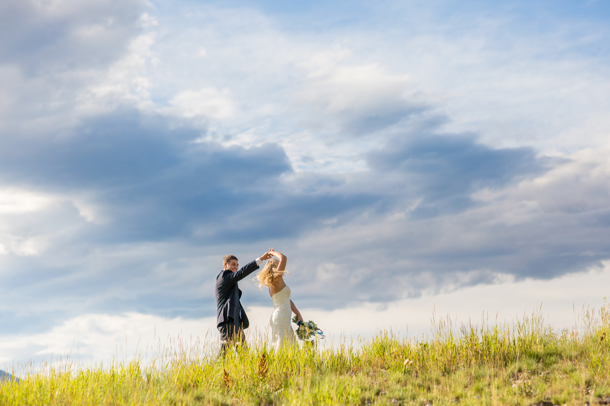 sweet colorado couples elopes at sapphire point lake dillon in breckenridge dancing candidly captured by colorado mountain wedding photographer kathryn kim