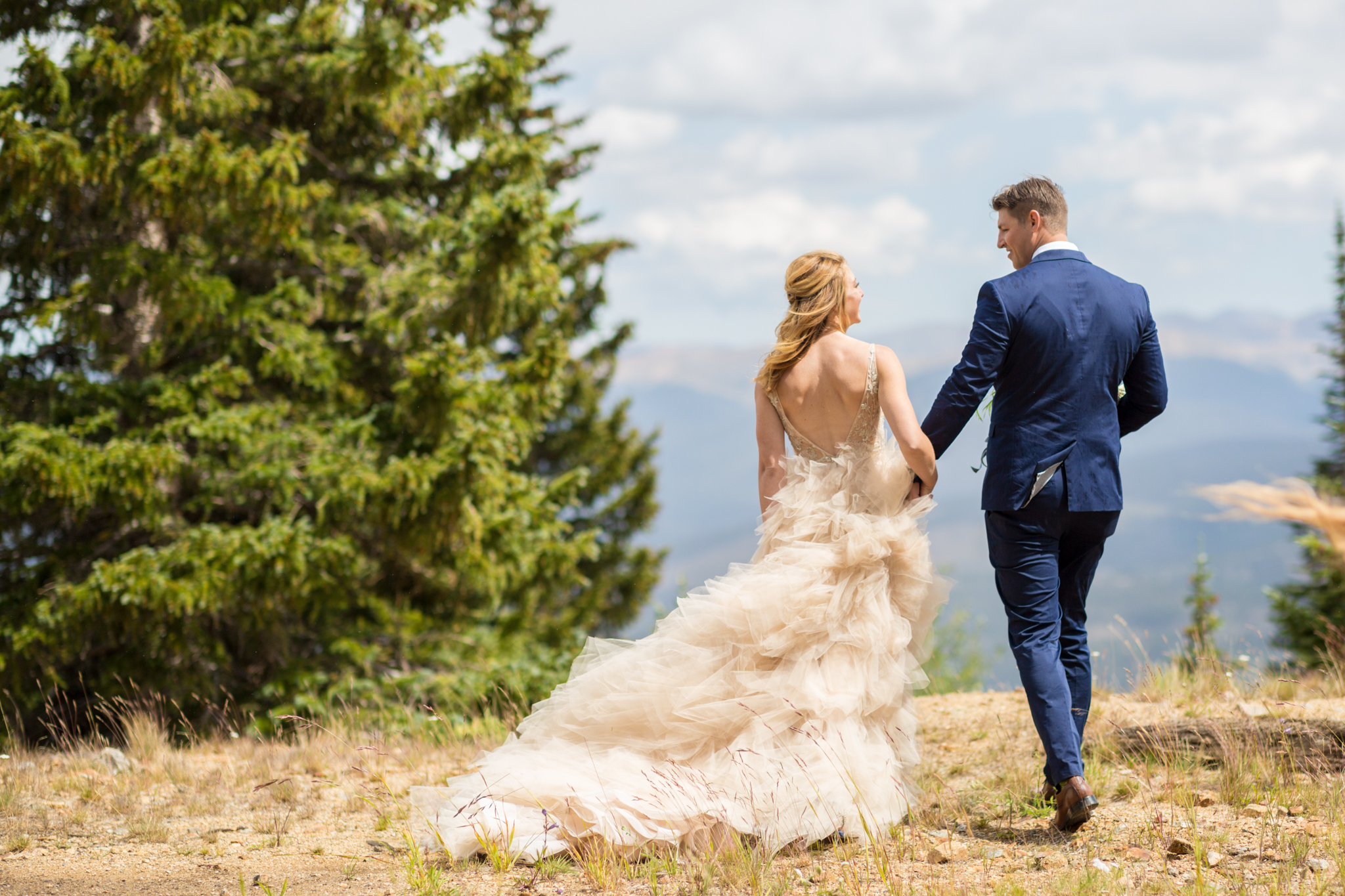 elegant tulle wedding gown bride and groom portraits in breckenridge colorado captured by mountain wedding photographer kathryn kim