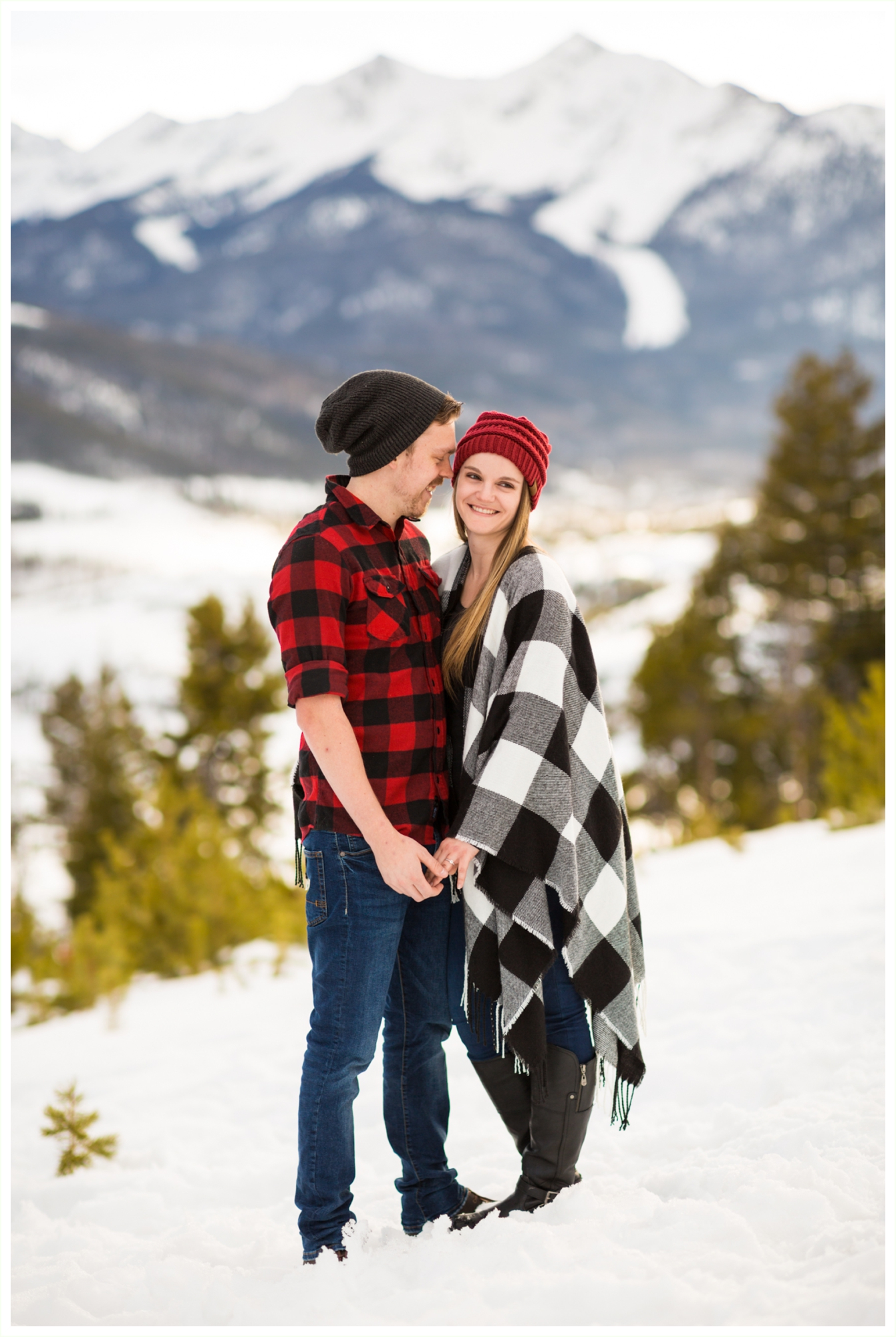 super cute and romantic lake dillon sapphire point breckenridge engagement photos plaid and beanies fashion